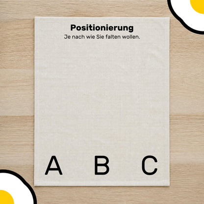 Positionierungsübersicht des Designs auf dem Bio-Baumwoll-Geschirrtuch.